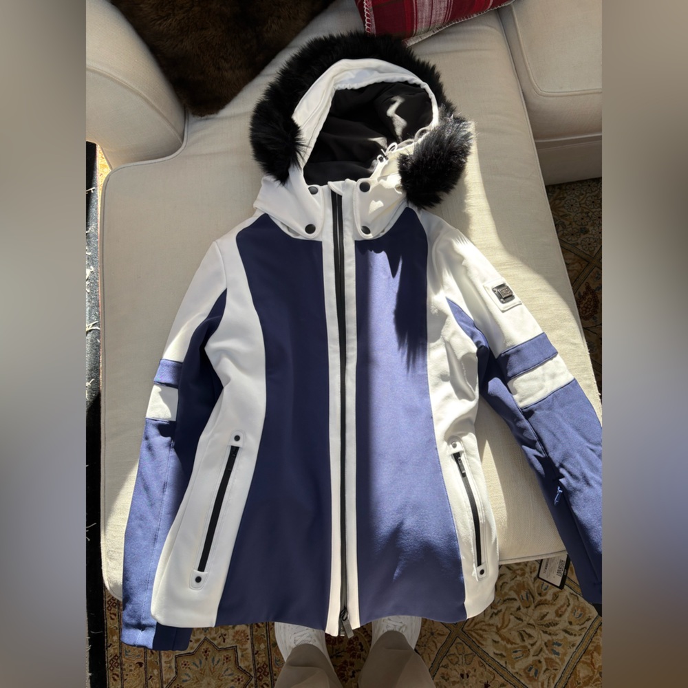 Nils ski jacket. Never worn, with tags, size 8. 
Fur trim on hood is not real